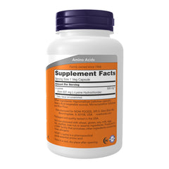 NOW Foods L-Lysine capsules close-up highlighting easy-to-swallow tablets.