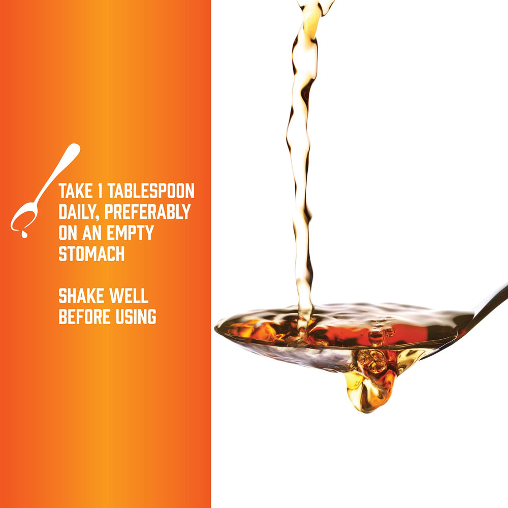 Citrus flavor Now Foods L-Carnitine Liquid in a glass, ready to drink