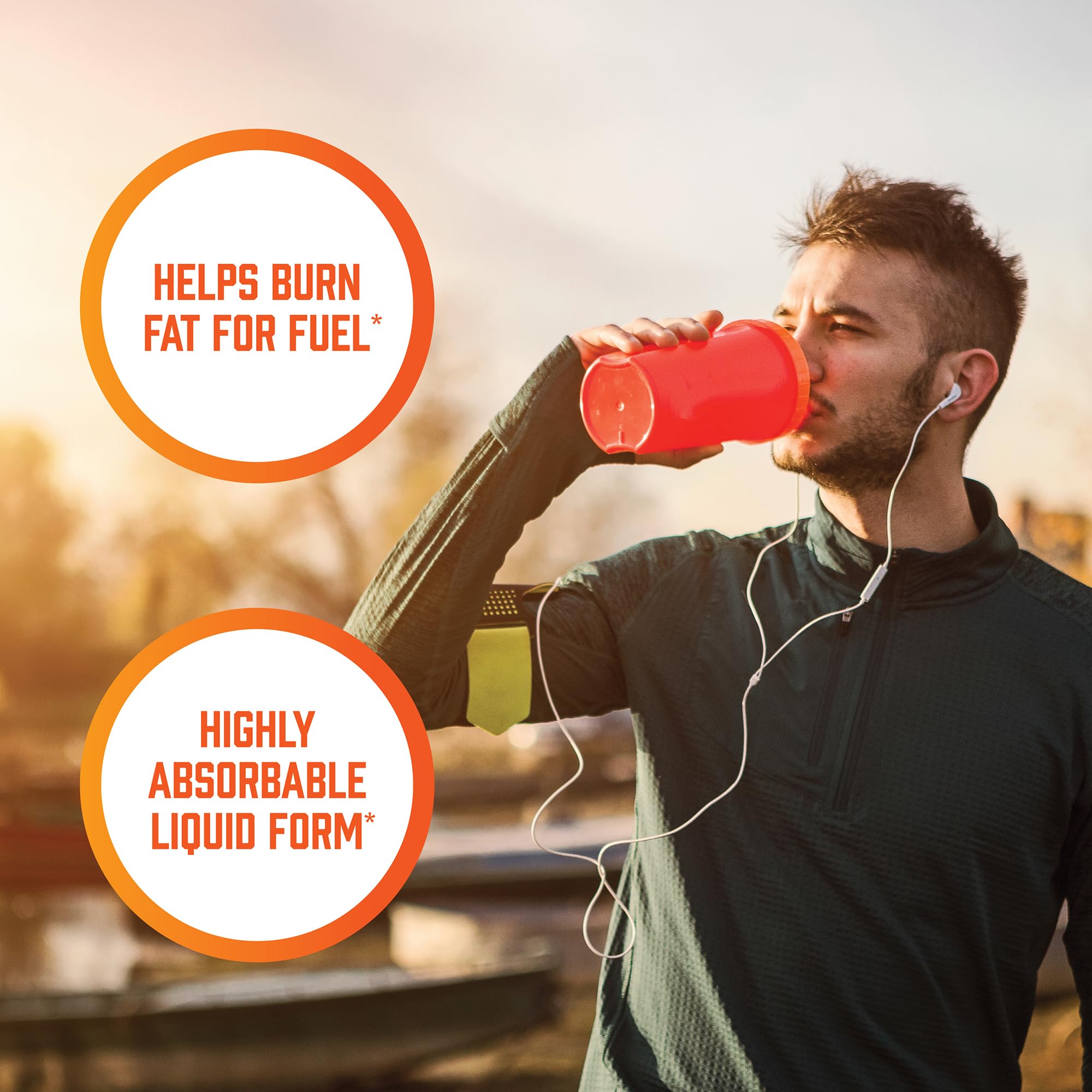 Splash of NOW Foods L-Carnitine Liquid over a surface to suggest refreshing drink