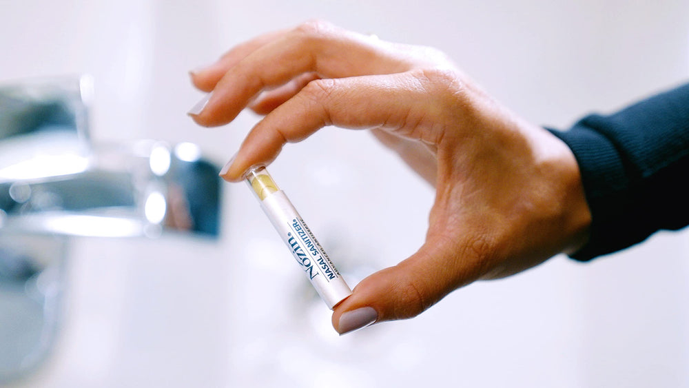 Nozin Popswab applied near the nostril for hygiene.