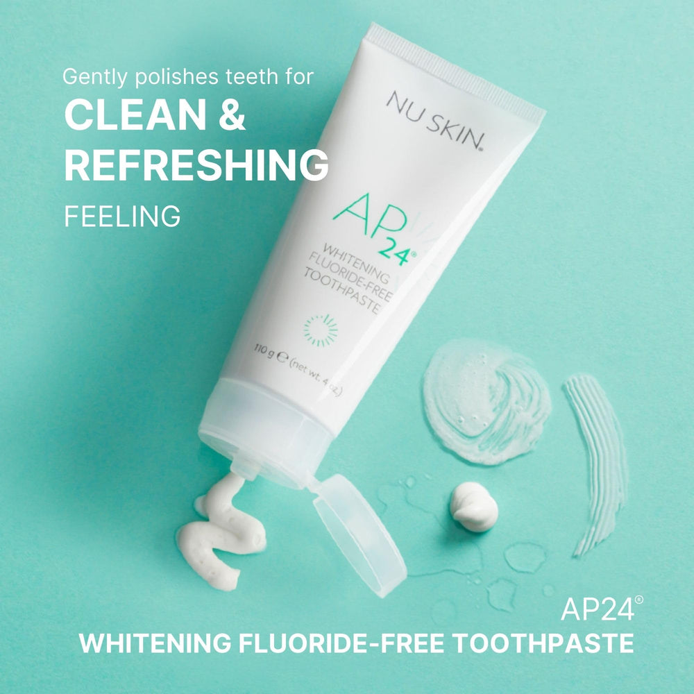 Nu Skin AP 24 whitening toothpaste close-up foam on brush for enamel-safe care.