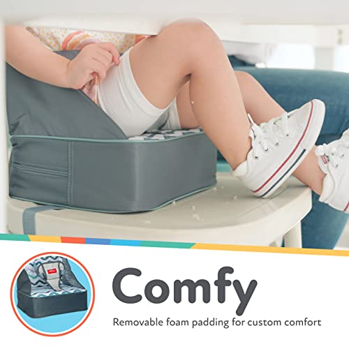 Nuby Easy Go Booster Seat with adjustable straps securing a child safely.