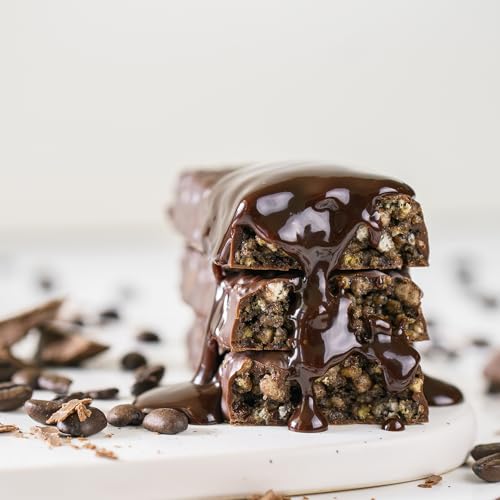 NuGo Dark Chocolate Peanut Butter Cup bar bite showing creamy peanut butter center