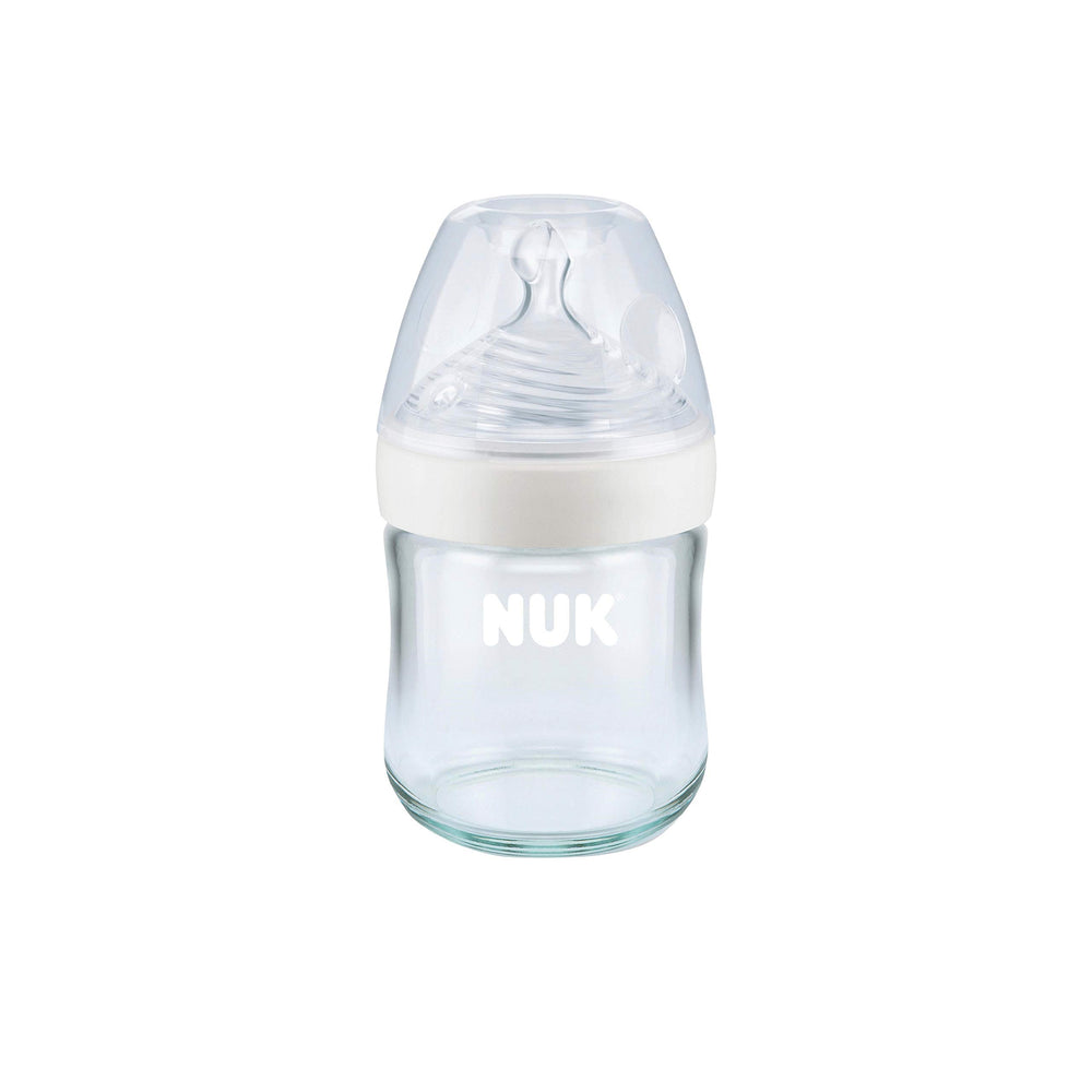 NUK Simply Natural bottle cap and glass set ready for travel use