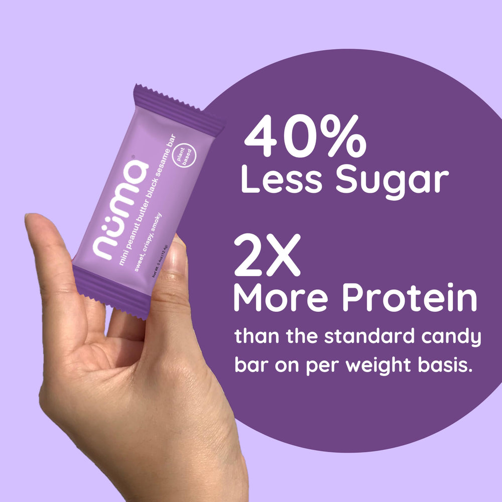 Numa Mini Peanut Butter Black Sesame Bar individually wrapped for portable office or gym snacks.