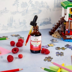 NutraChamps Kids B Complex drops pour; easy dosing for picky eaters.