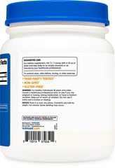 Nutricost L-Leucine powder facility badge signals rigorous manufacturing standards.