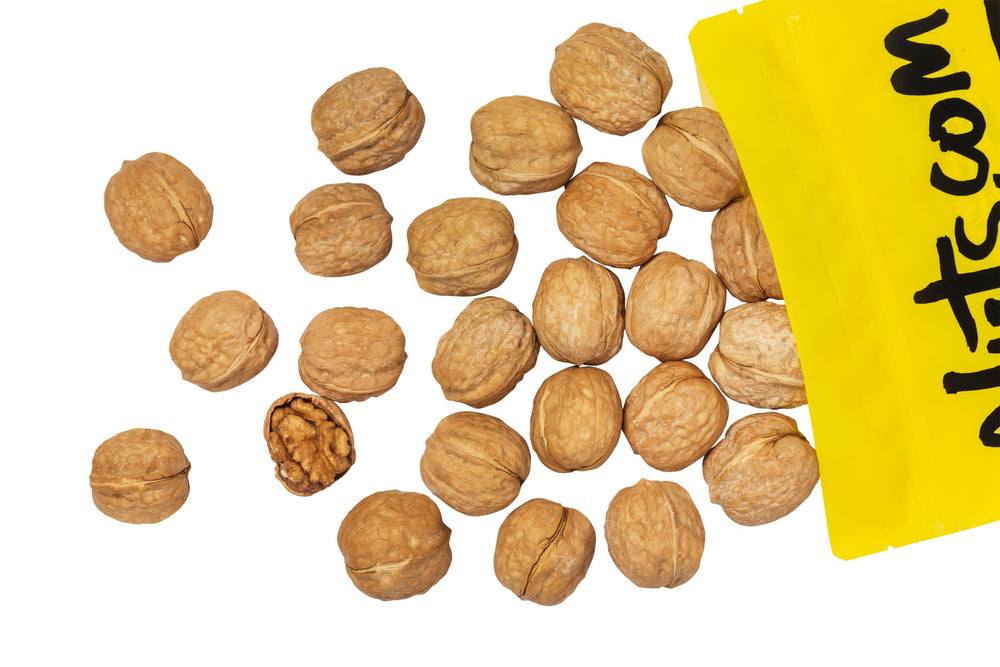 Nuts.com whole walnuts in shell on cutting board ready for cooking