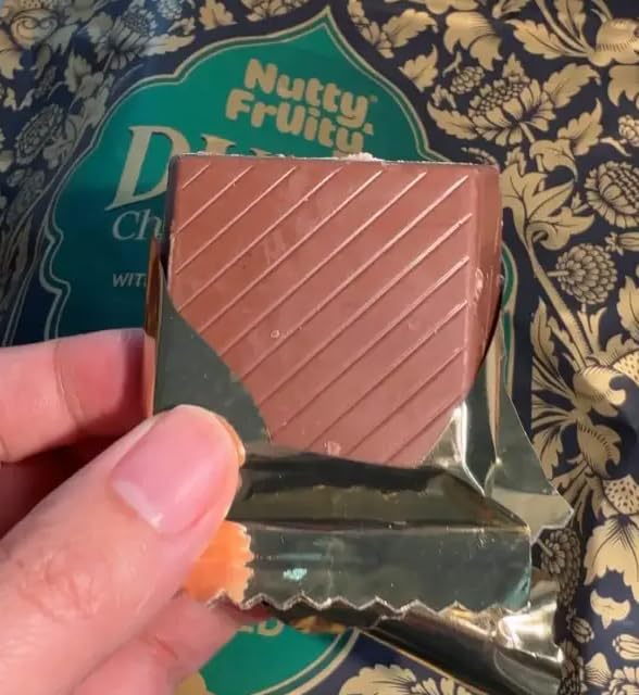 Nutty and Fruity Dubai Chocolate Bars pistachio crunch close-up, highlighting creamy texture.