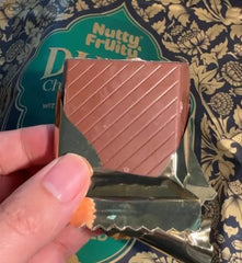 Nutty and Fruity Dubai Chocolate Bars pistachio crunch close-up, highlighting creamy texture.