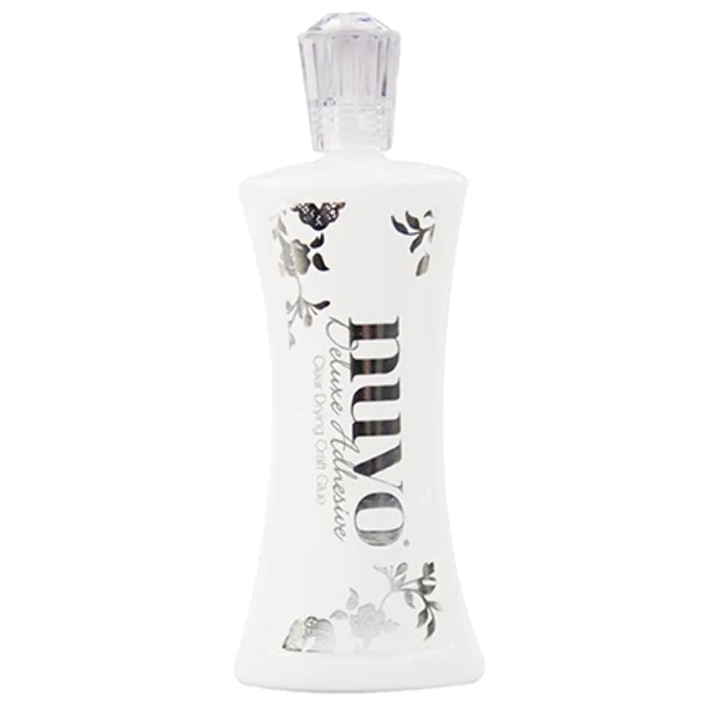 Nuvo Deluxe Adhesive bottle with built-in brush provides precise, long-lasting bonding for paper and fabric projects.