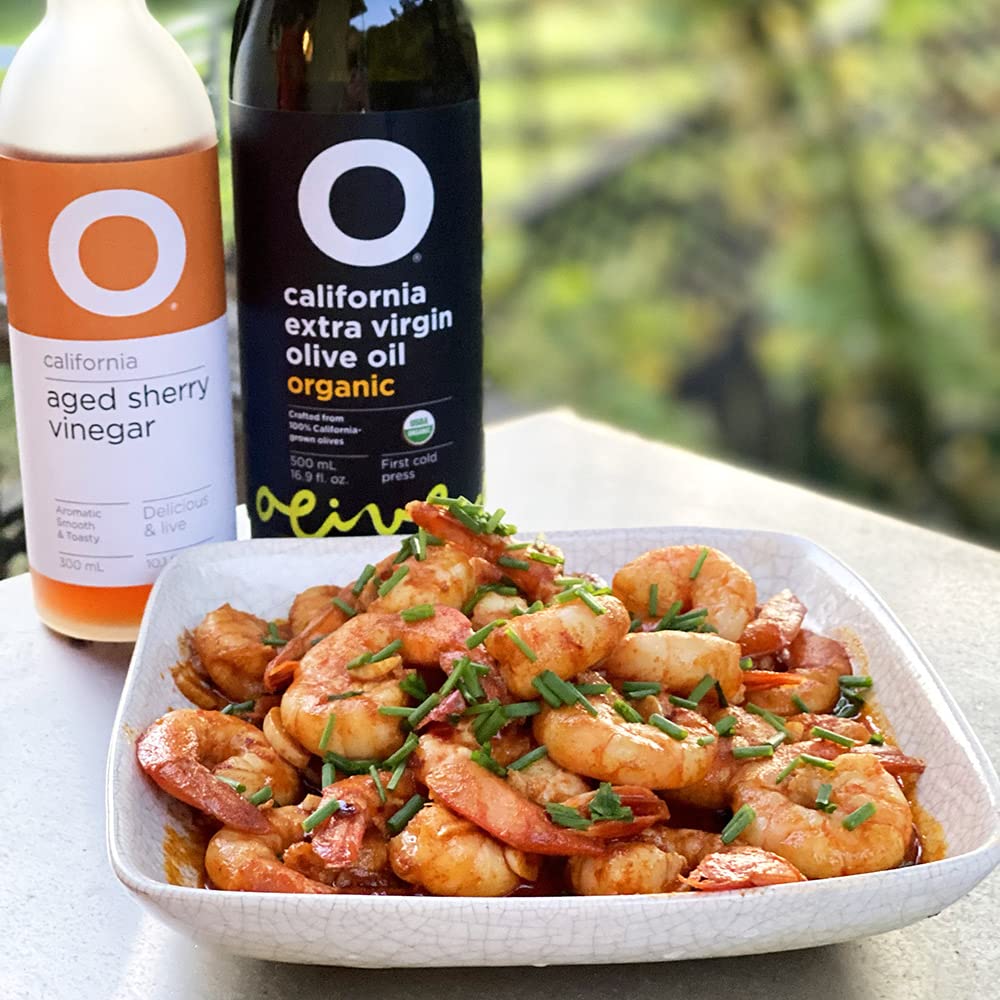 O Olive Oil aged sherry vinegar drizzle on tomato slices elevates salads