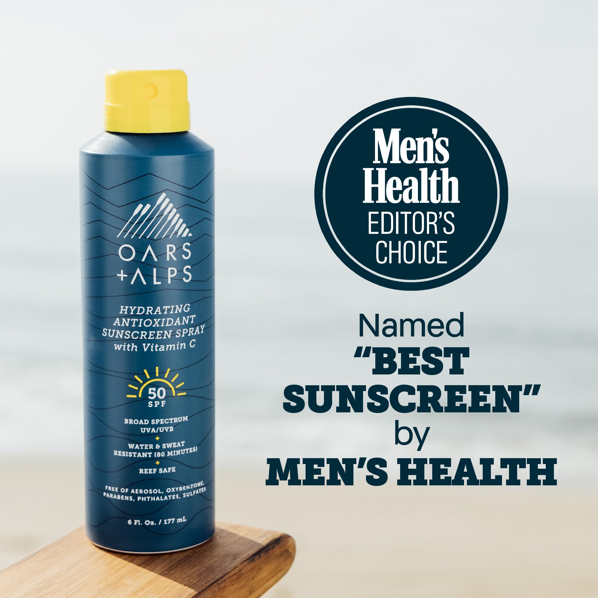 Applying Oars + Alps SPF 50 spray on skin for even protection.