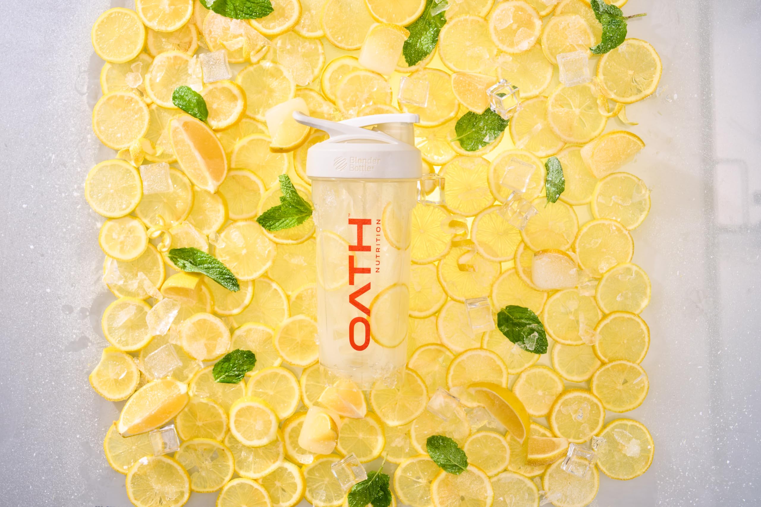 Oath Nutrition Clear Whey Frosty Lemonade on the beach signaling a refreshing workout companion.