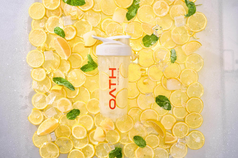 Oath Nutrition Clear Whey Frosty Lemonade on the beach signaling a refreshing workout companion.
