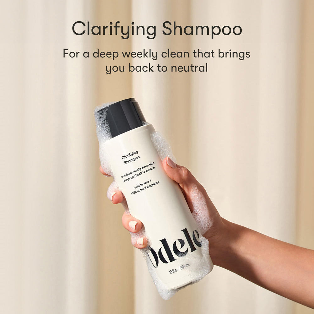 Odele Clarifying Shampoo bottle side view; chelation protects color during cleansing