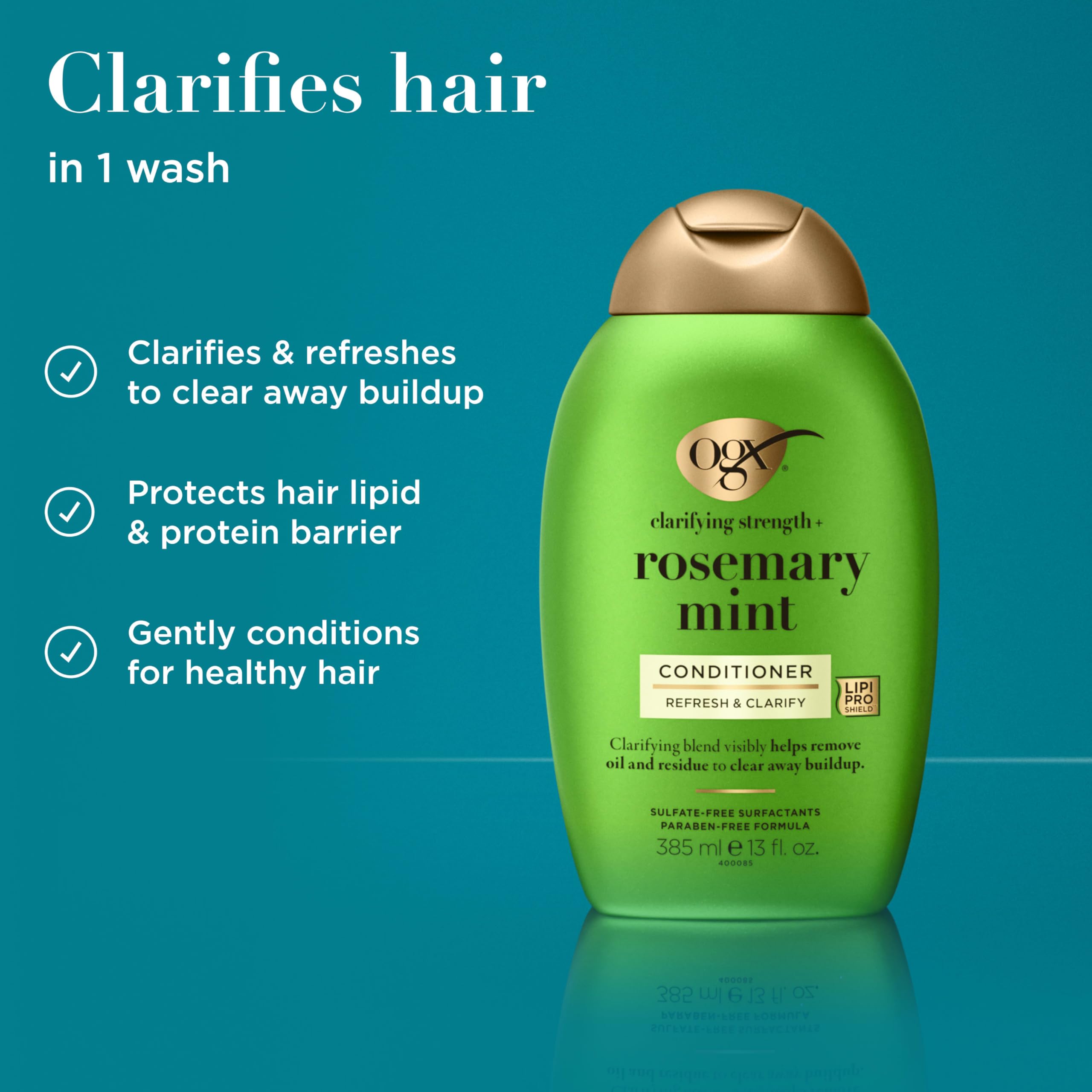 OGX Clarifying Strength + Rosemary Mint Conditioner label closeup emphasizes rosemary and peppermint infusion