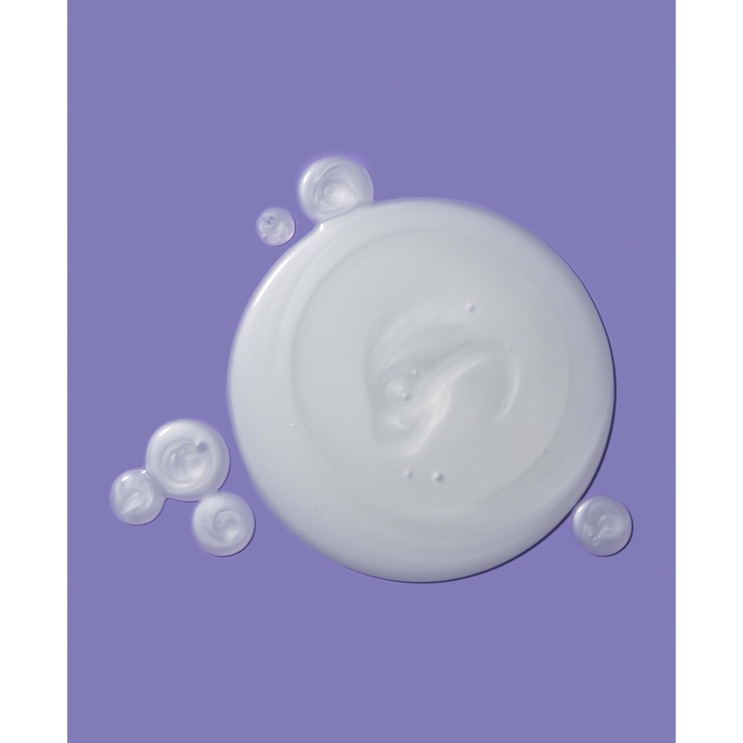 OGX Damage Remedy bottle cap close-up signaling premium conditioning benefits