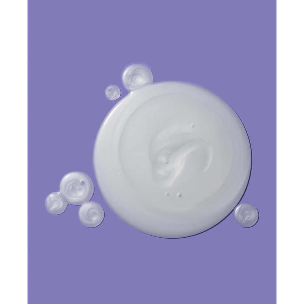 OGX Damage Remedy bottle cap close-up signaling premium conditioning benefits