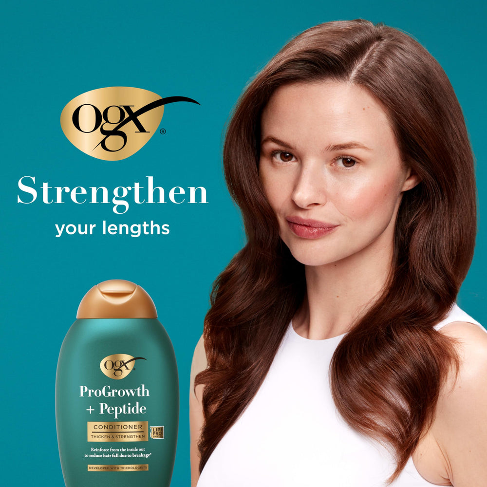 OGX ProGrowth + Peptide Conditioner application on wet hair demonstrates even distribution