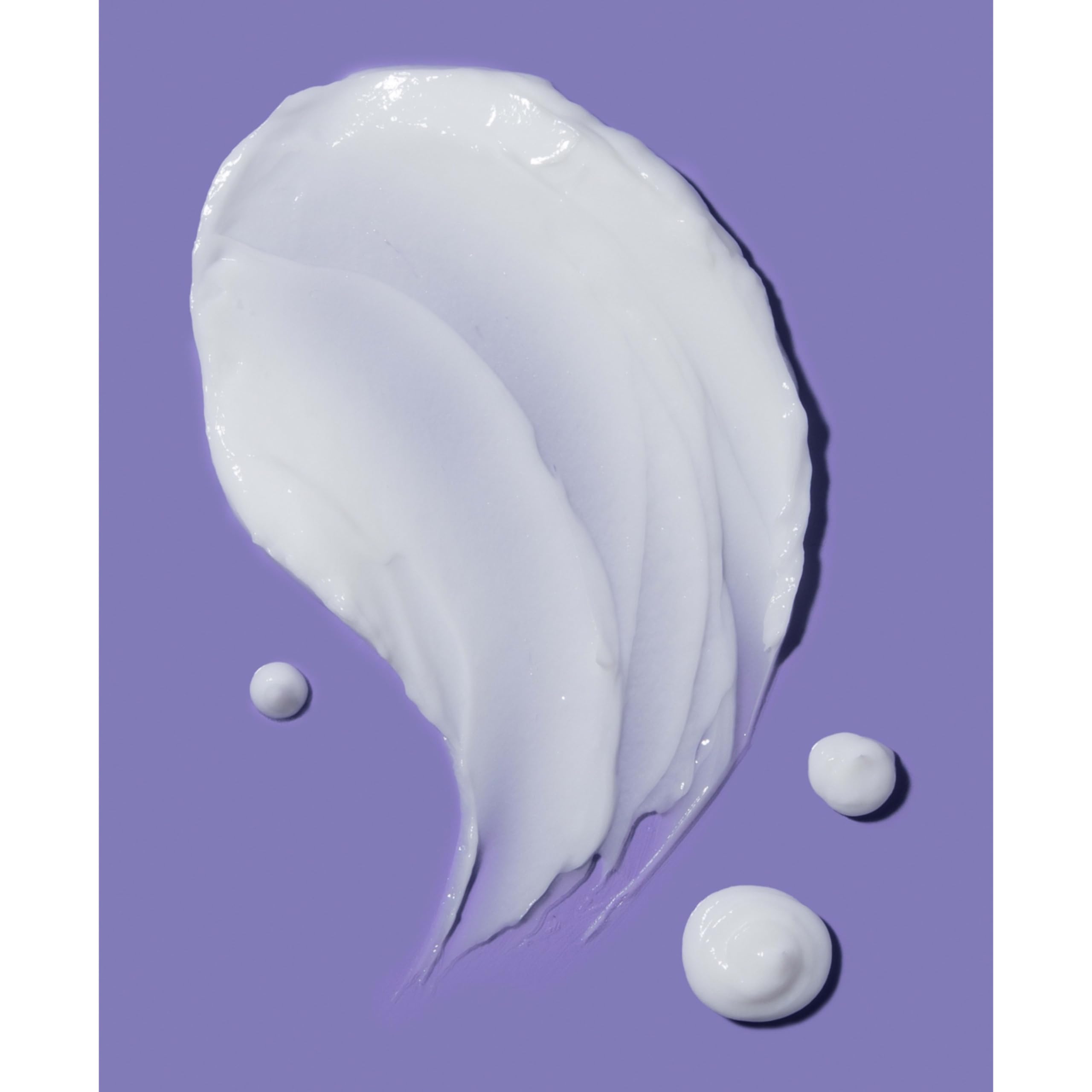 Frizz-control benefits evidenced by gloss and sleek strands with OGX coconut conditioner.