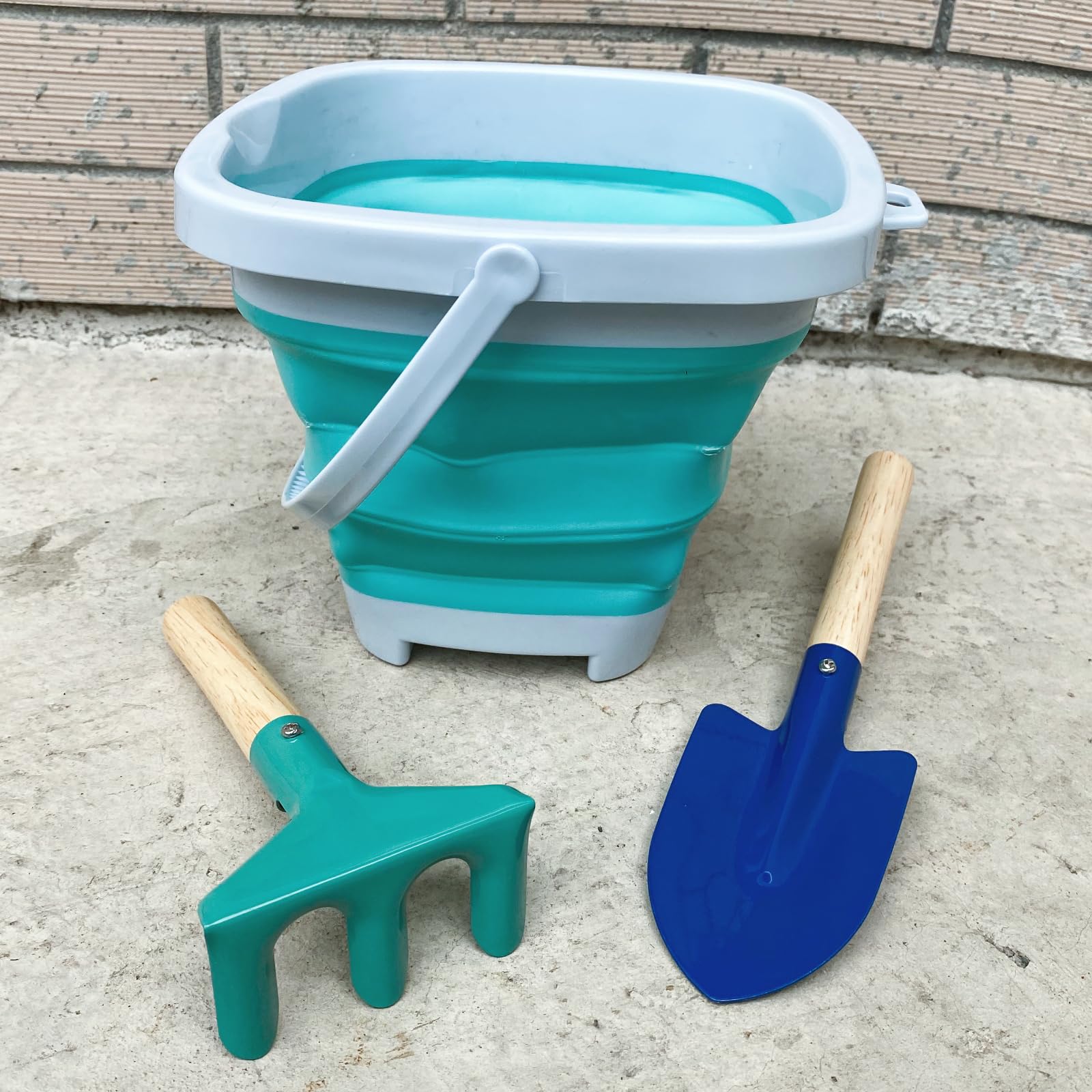 OKGD metal shovel with wooden handle, sturdy digging for young explorers.