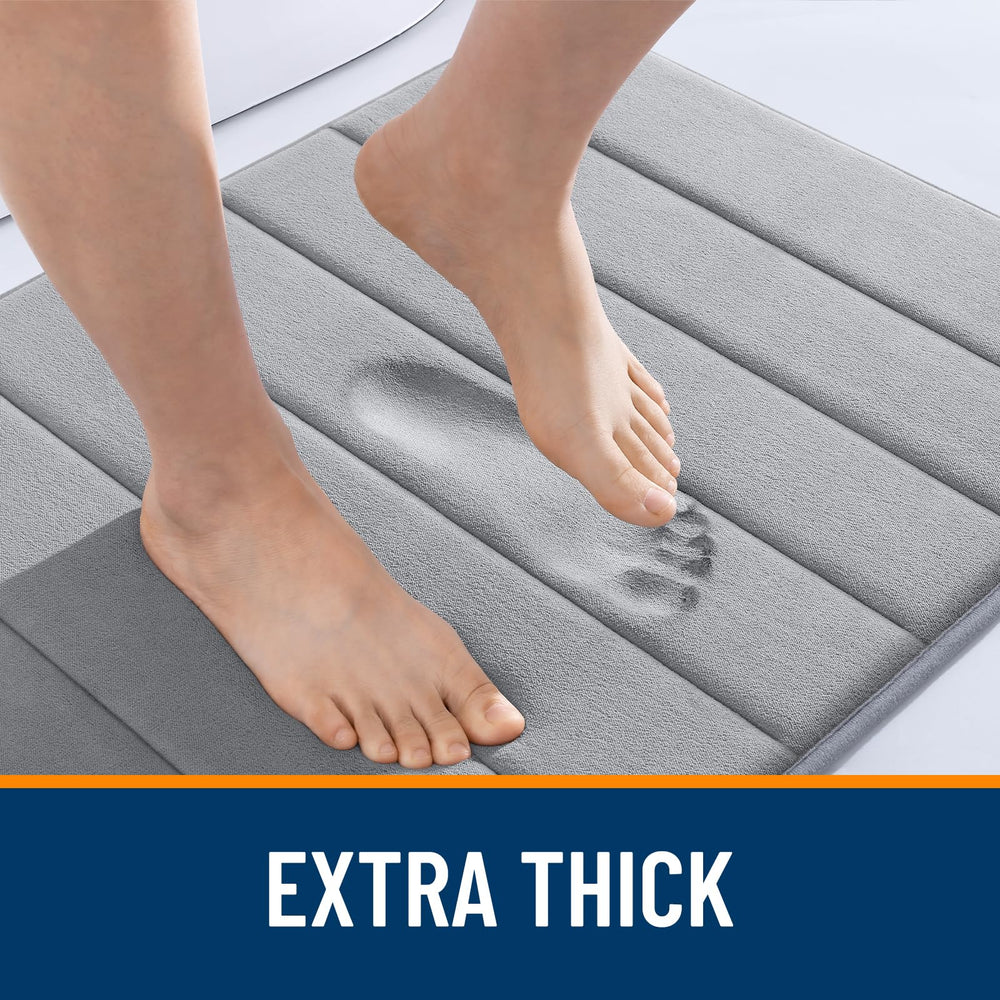 OLANLY memory foam bath mat folded for compact storage