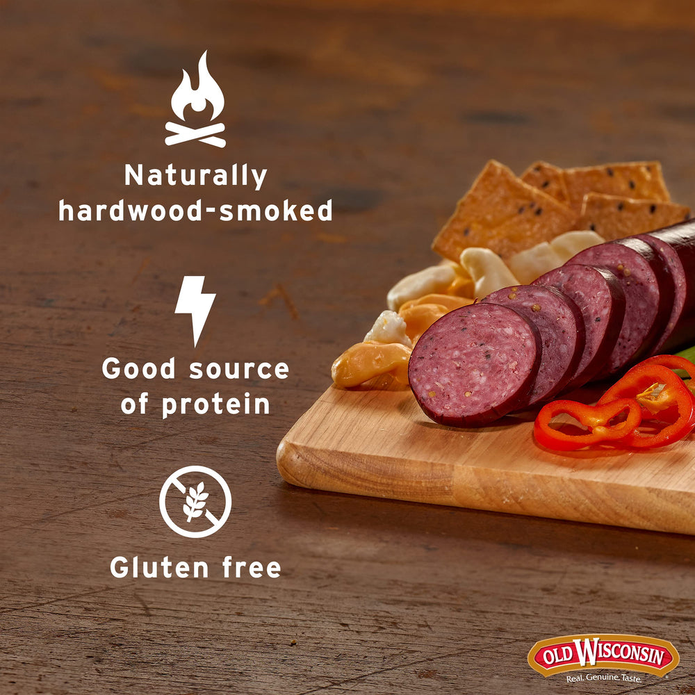 Old Wisconsin beef sausage on a charcuterie board with cheese and fruit.