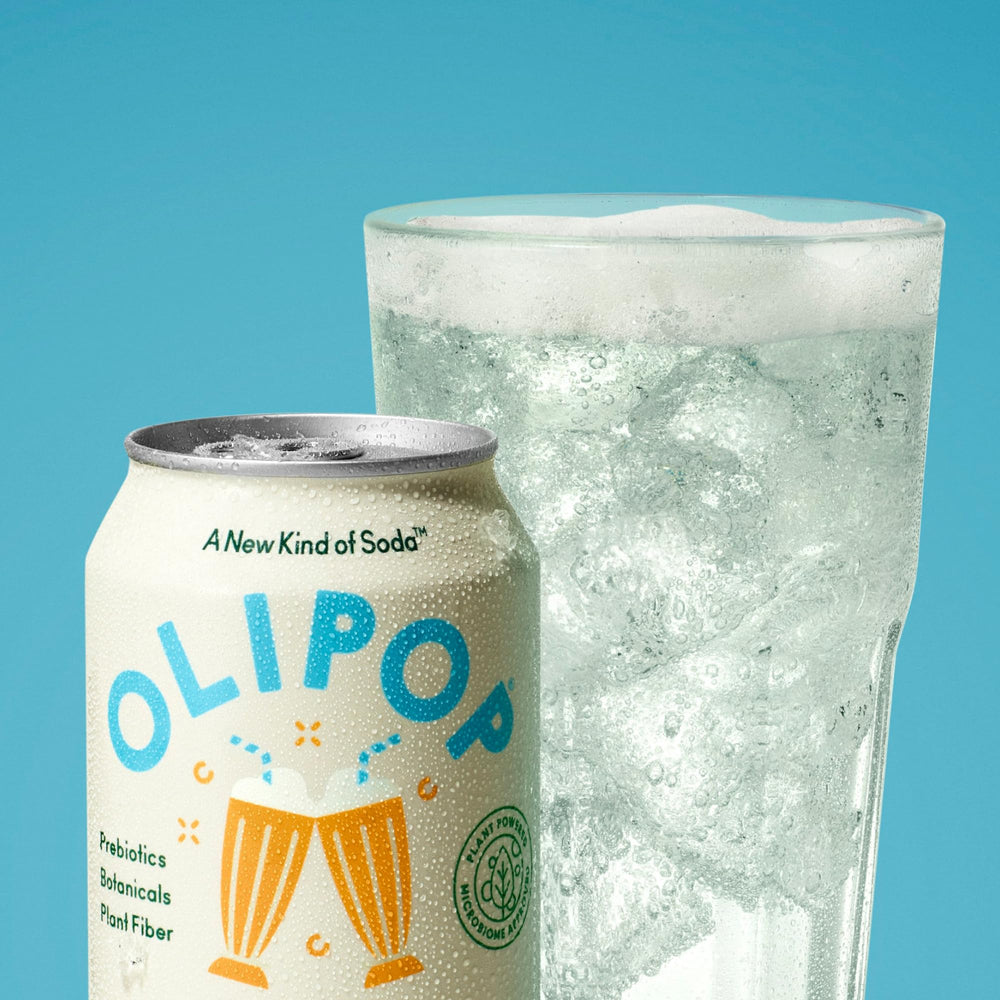 OLIPOP glass pouring into tumbler to capture refreshing, fizzy experience.