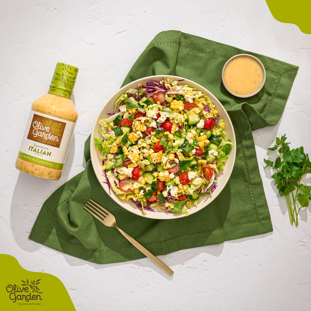 Olive Garden Signature Italian Dressing dipping scene demonstrates versatile sauce for bread.