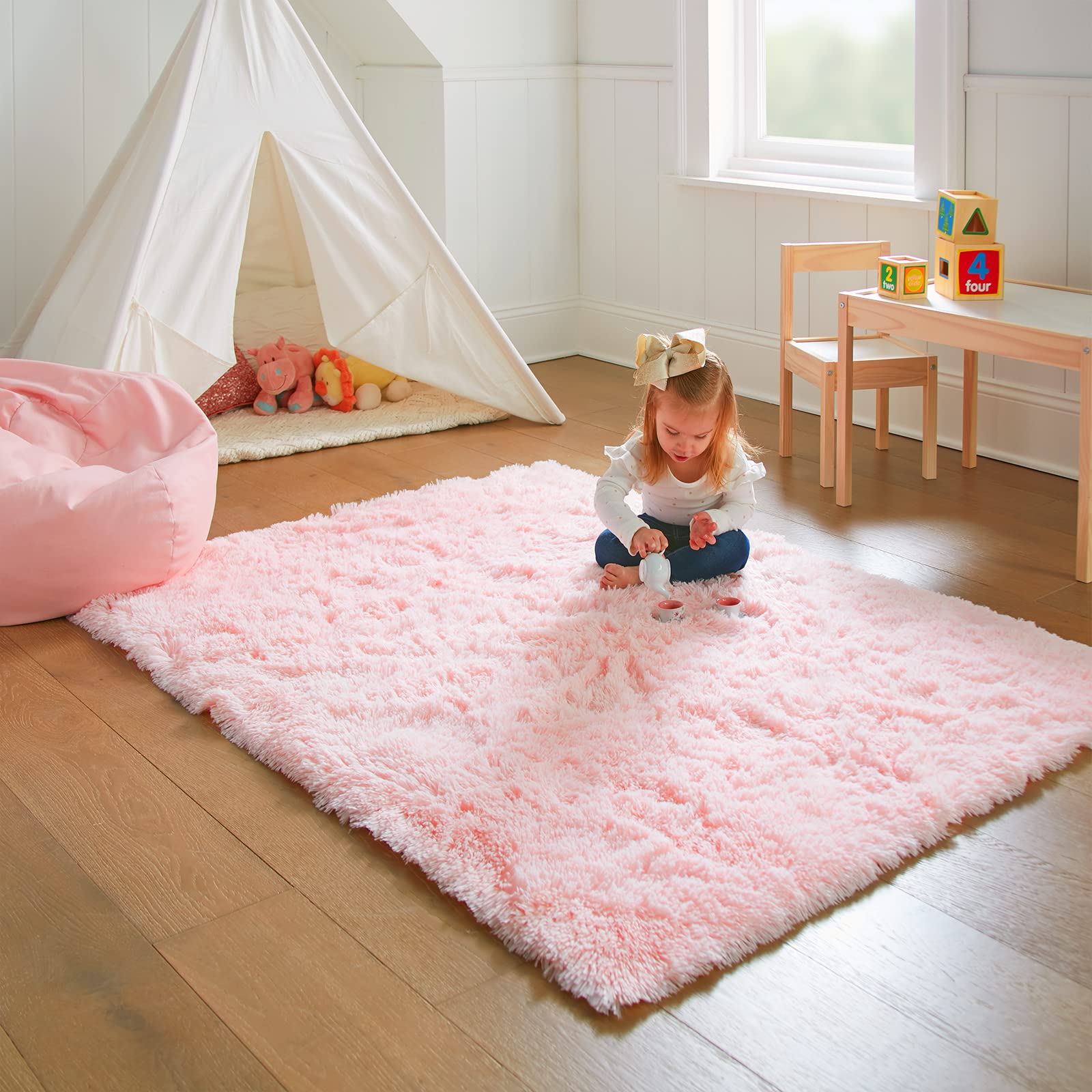 Ophanie indoor rug for playroom; kid-friendly surface for activity.