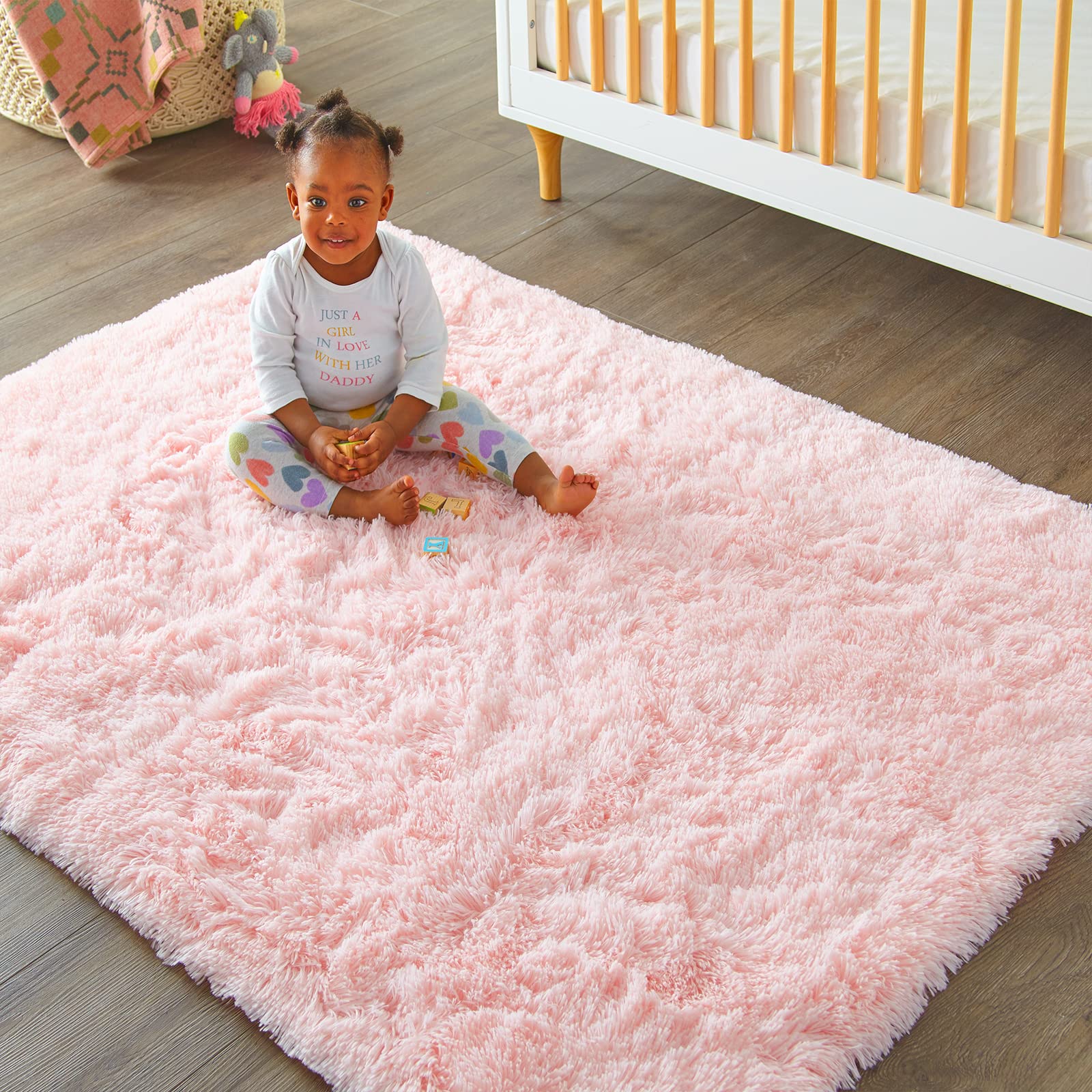 Ophanie pink rug for dorm room; budget-friendly decor with comfort.