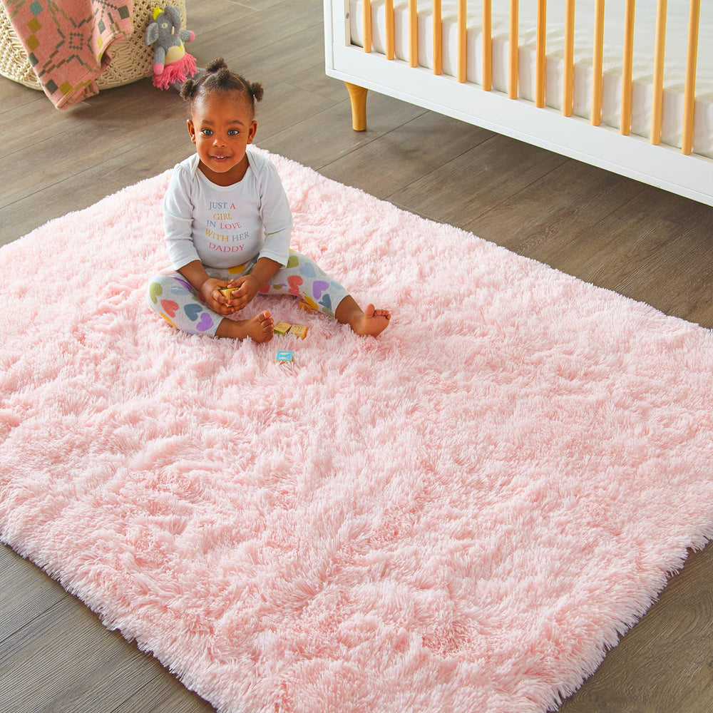 Ophanie pink rug for dorm room; budget-friendly decor with comfort.