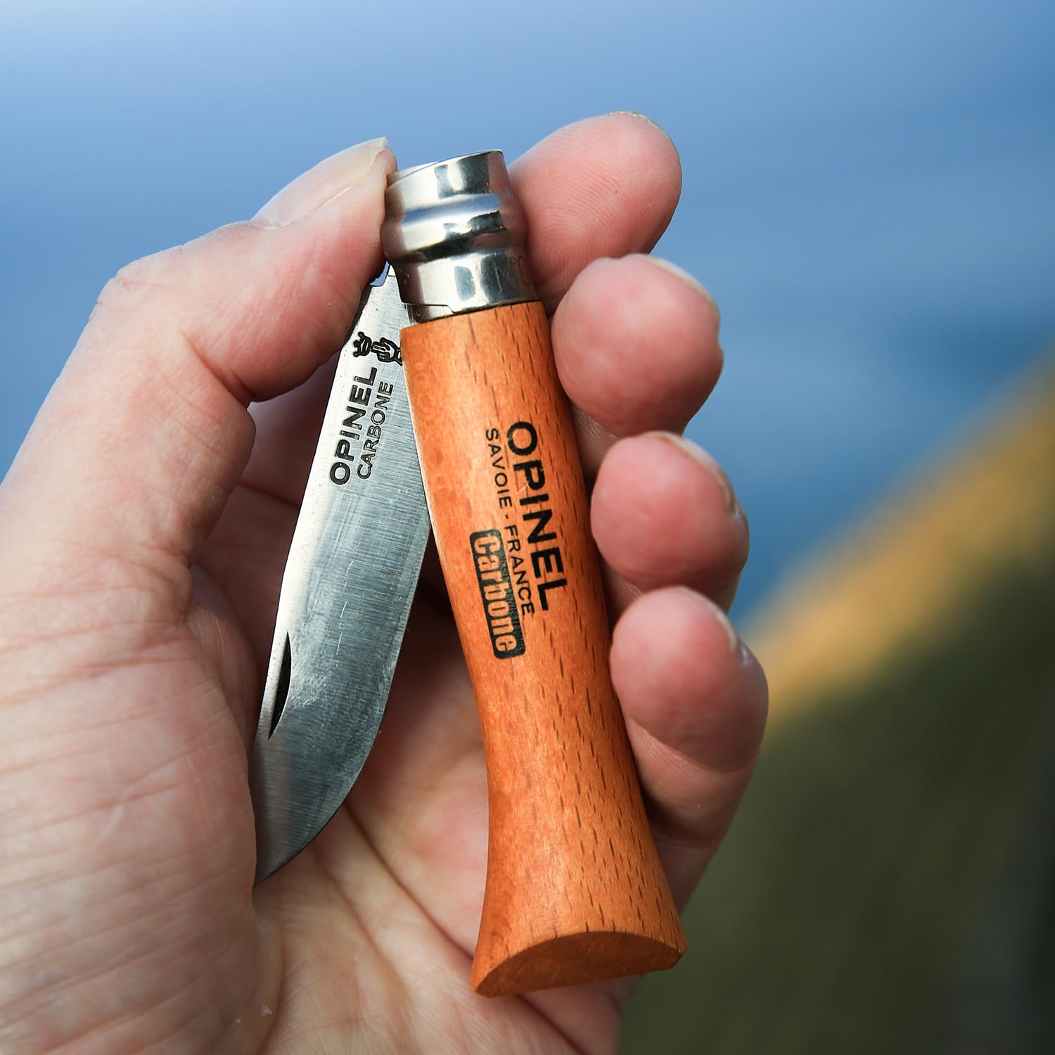 Opinel No. 08 Carbone blade close-up highlighting a sharp edge.