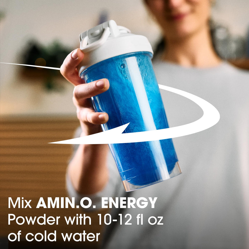 Optimum Nutrition Amino Energy scoop beside tub ready to mix.