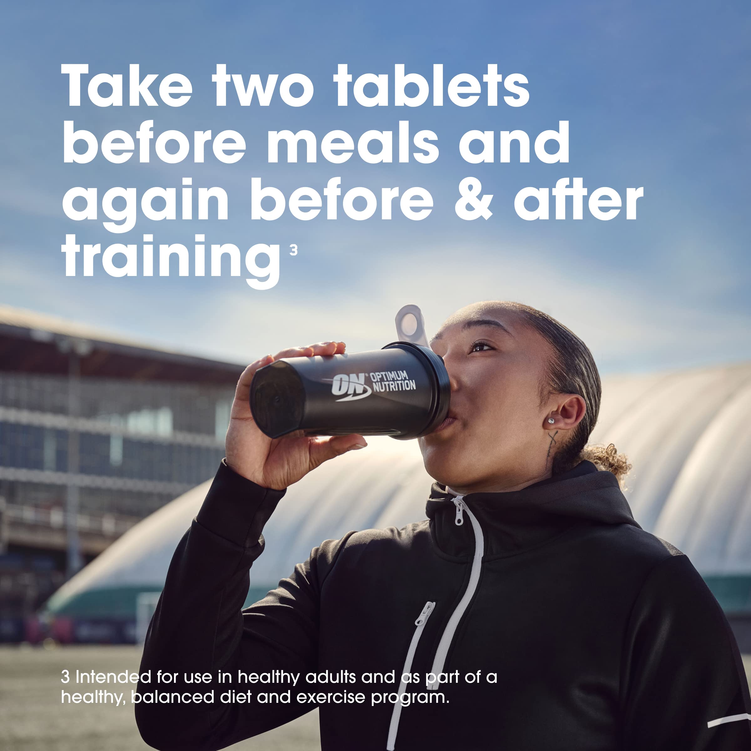 Optimum Nutrition BCAA capsules arranged with a protein shake for on-the-go hydration