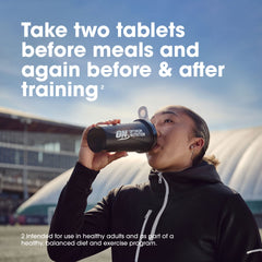 Optimum Nutrition BCAA capsules beside gym bottle for pre- and post-workout use