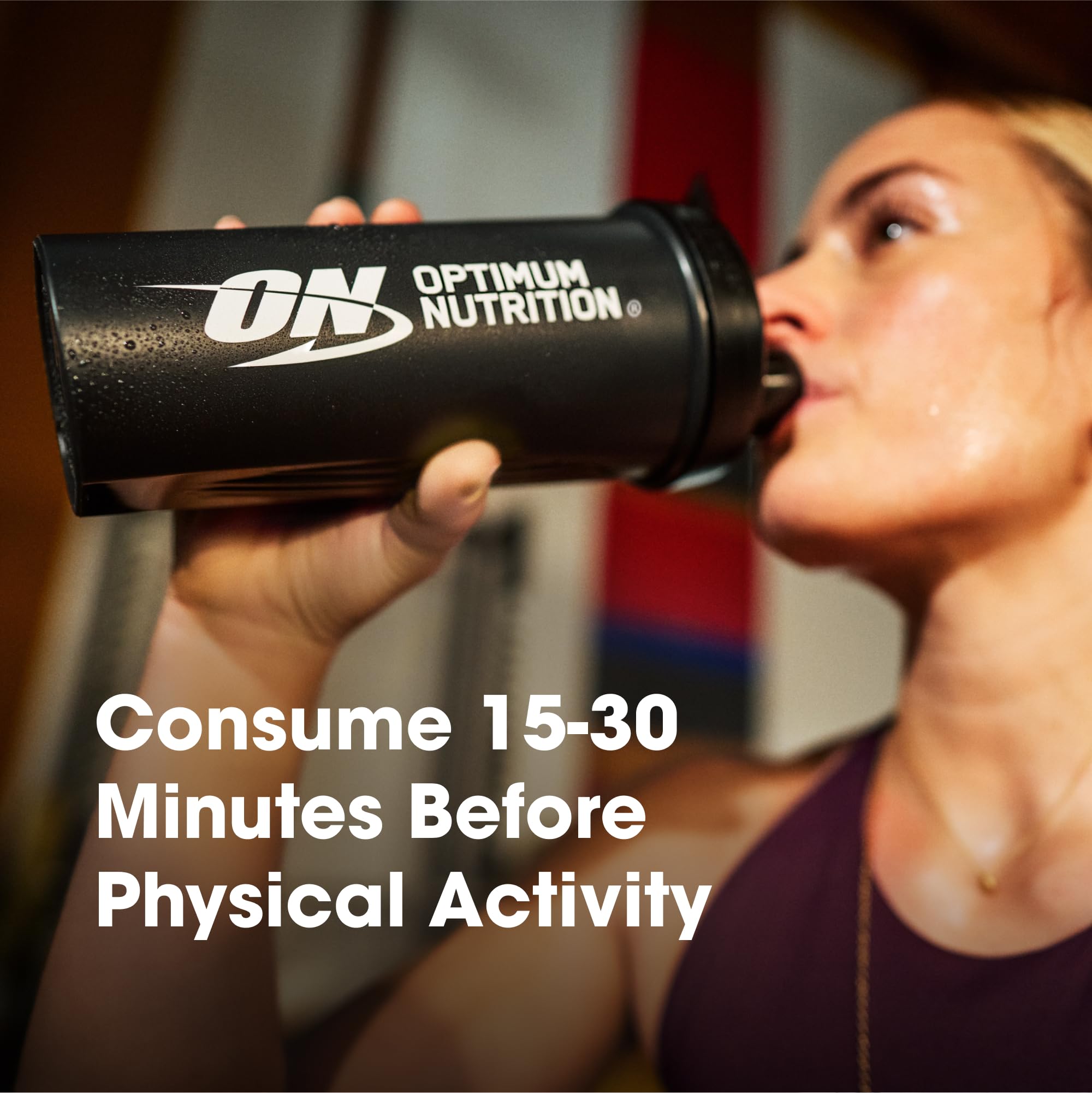 A gym bag with Optimum Nutrition Gold Standard Pre-Workout Fruit Punch and bottle