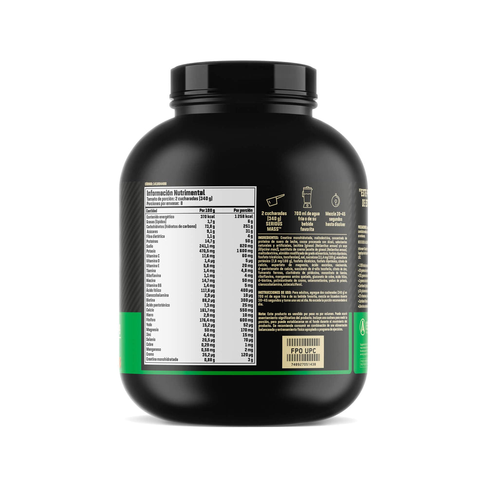 Optimum Nutrition Serious Mass measuring scoop beside the tub.