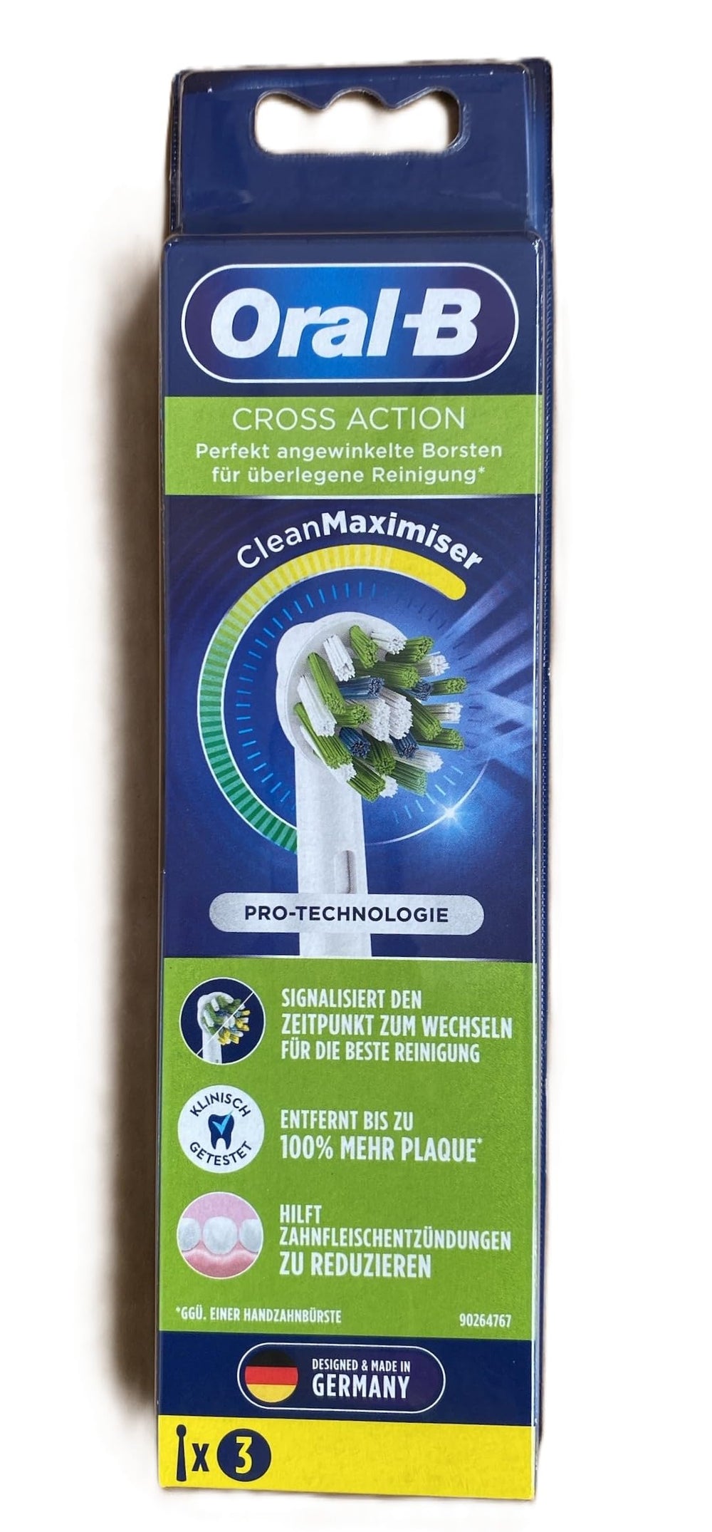 Oral-B Cross Action head white; angled bristles target plaque between teeth.