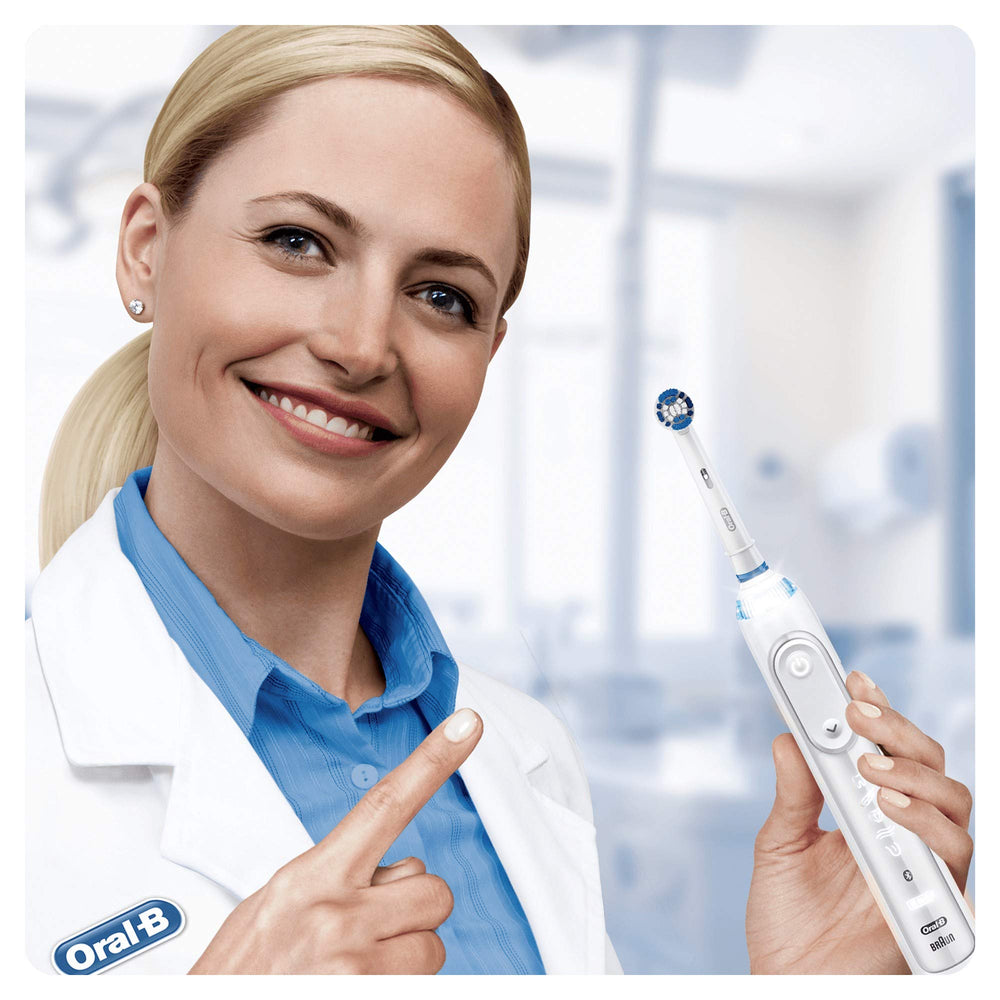 Oral-B Precision Clean head surrounds each tooth for targeted cleaning.