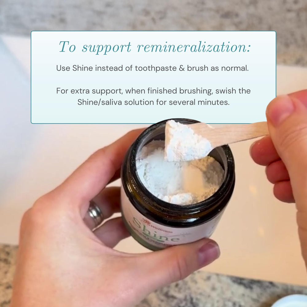 Powder on a moistened toothbrush shows easy application as a natural toothpaste alternative