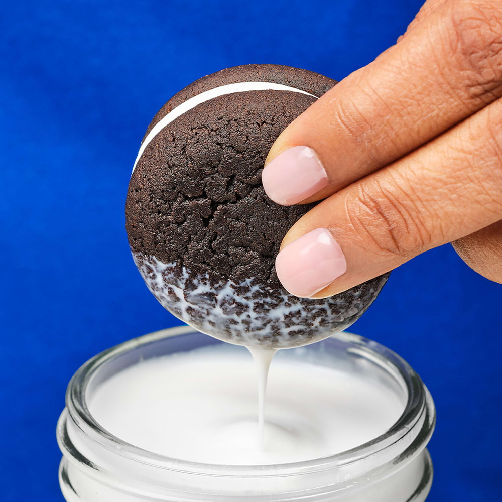 Office desk snack time with OREO Cakesters on a plate.