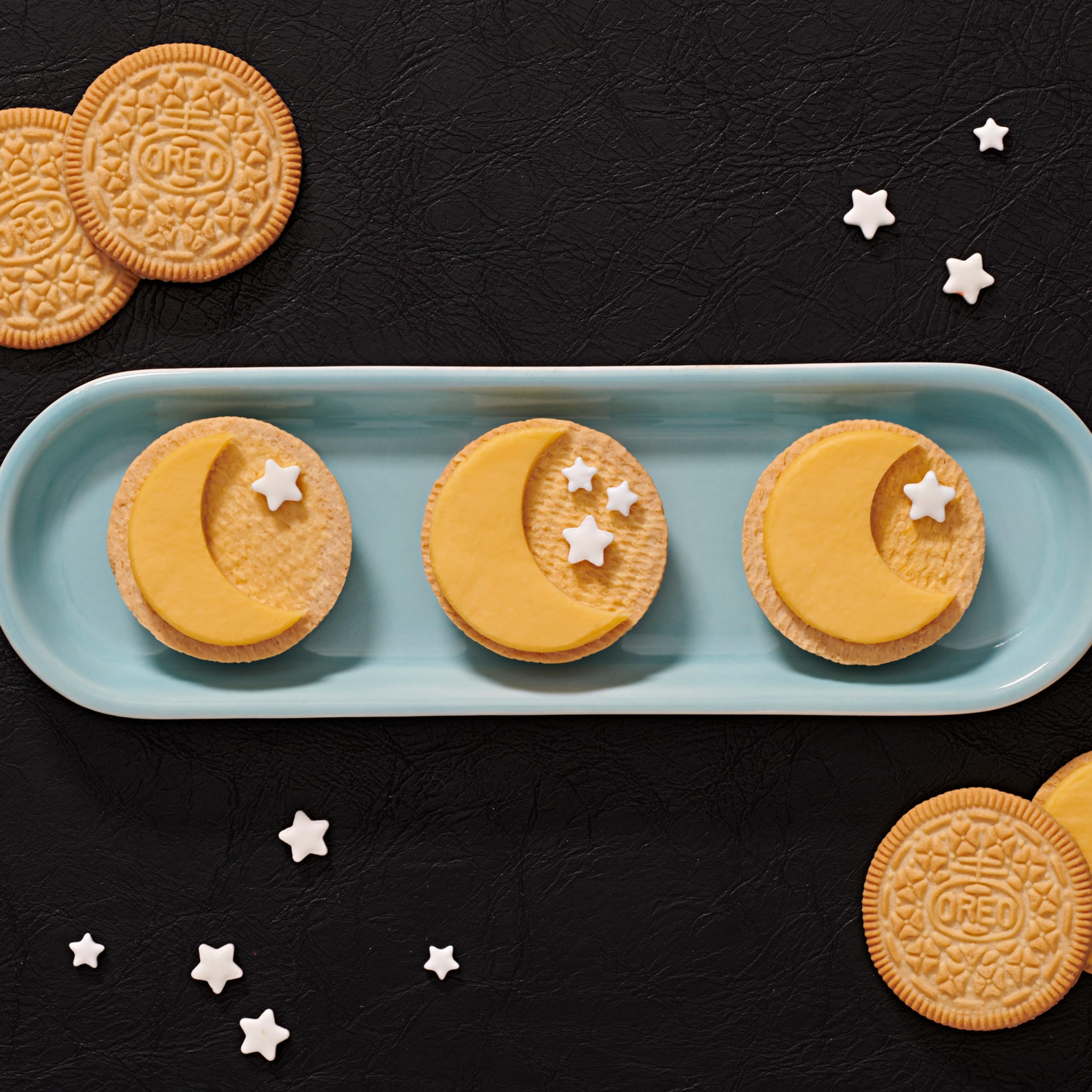 OREO Lemon Creme dunkable cookies with milk splash, ready for a dunking moment.