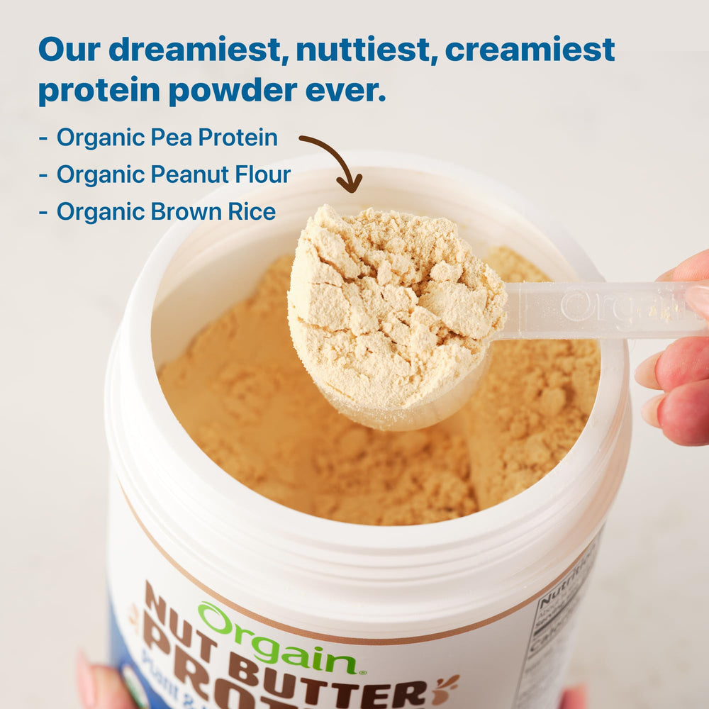Orgain Vanilla Almond Butter protein powder being shaken into a glass for a creamy shake