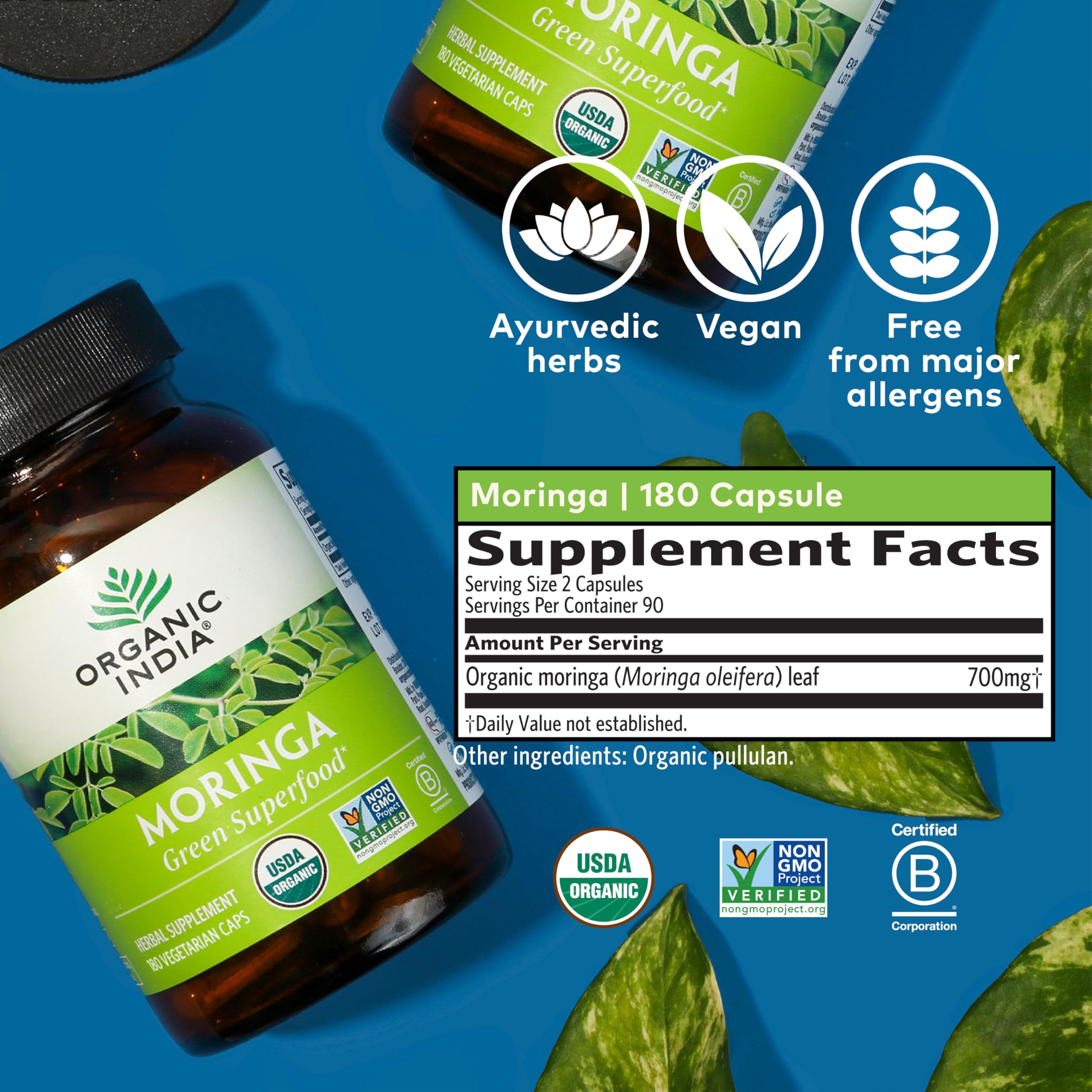 Organic India Moringa capsules on green background conveys natural vitality.