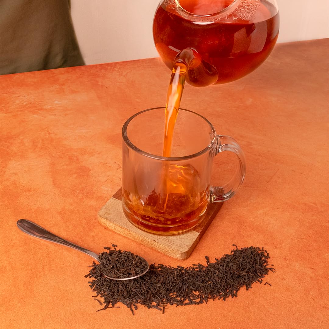 Organic Positively Tea Company Assam TGFOP tea in ceramic canister preserves freshness and aroma.