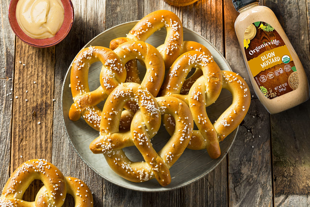 Organicville Dijon mustard on a sandwich topping image demonstrates versatile use.