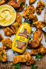Organicville Yellow Mustard jar-closeup reveals vibrant color for grilling and dipping.