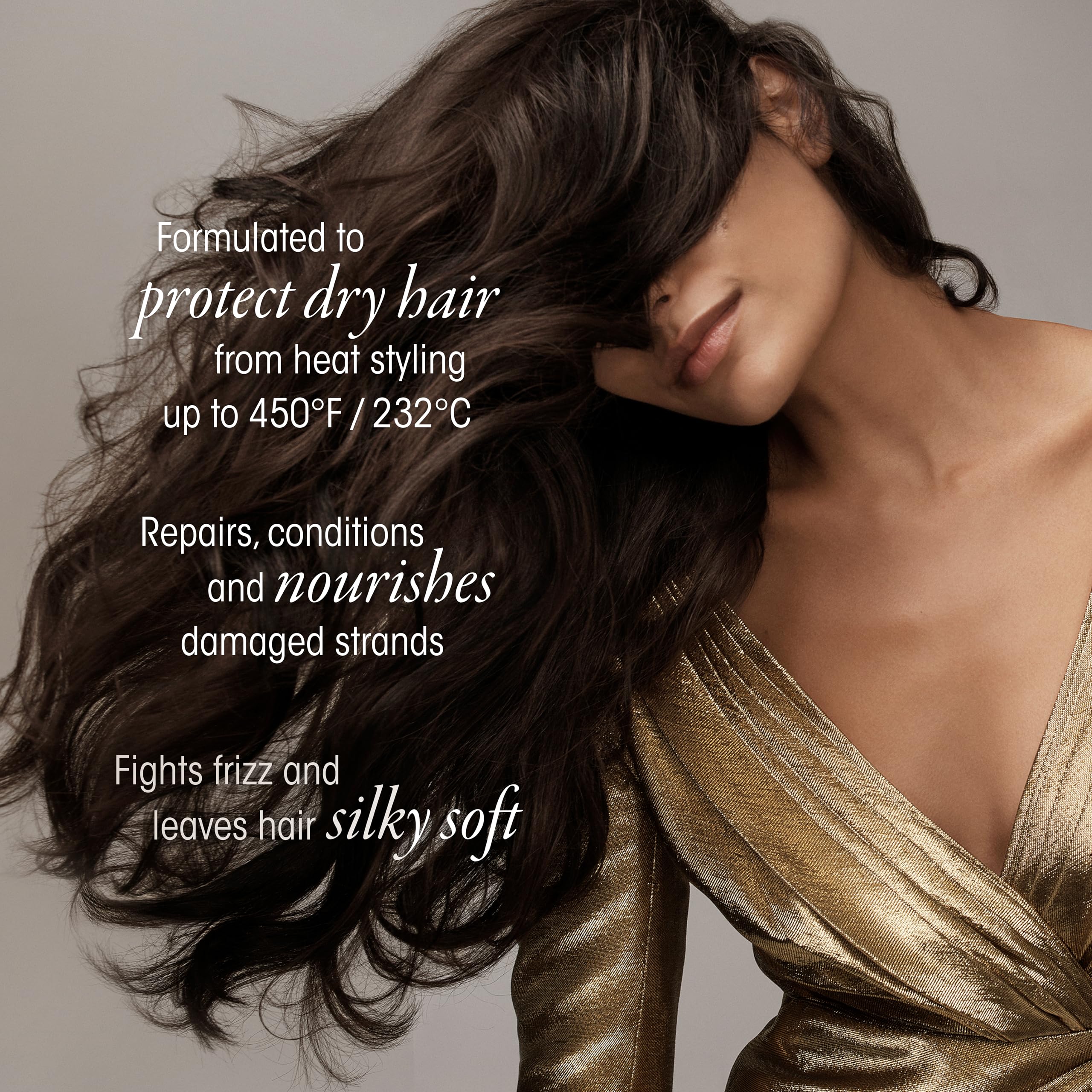 Oribe Gold Lust spray being applied to dry hair for a silky finish